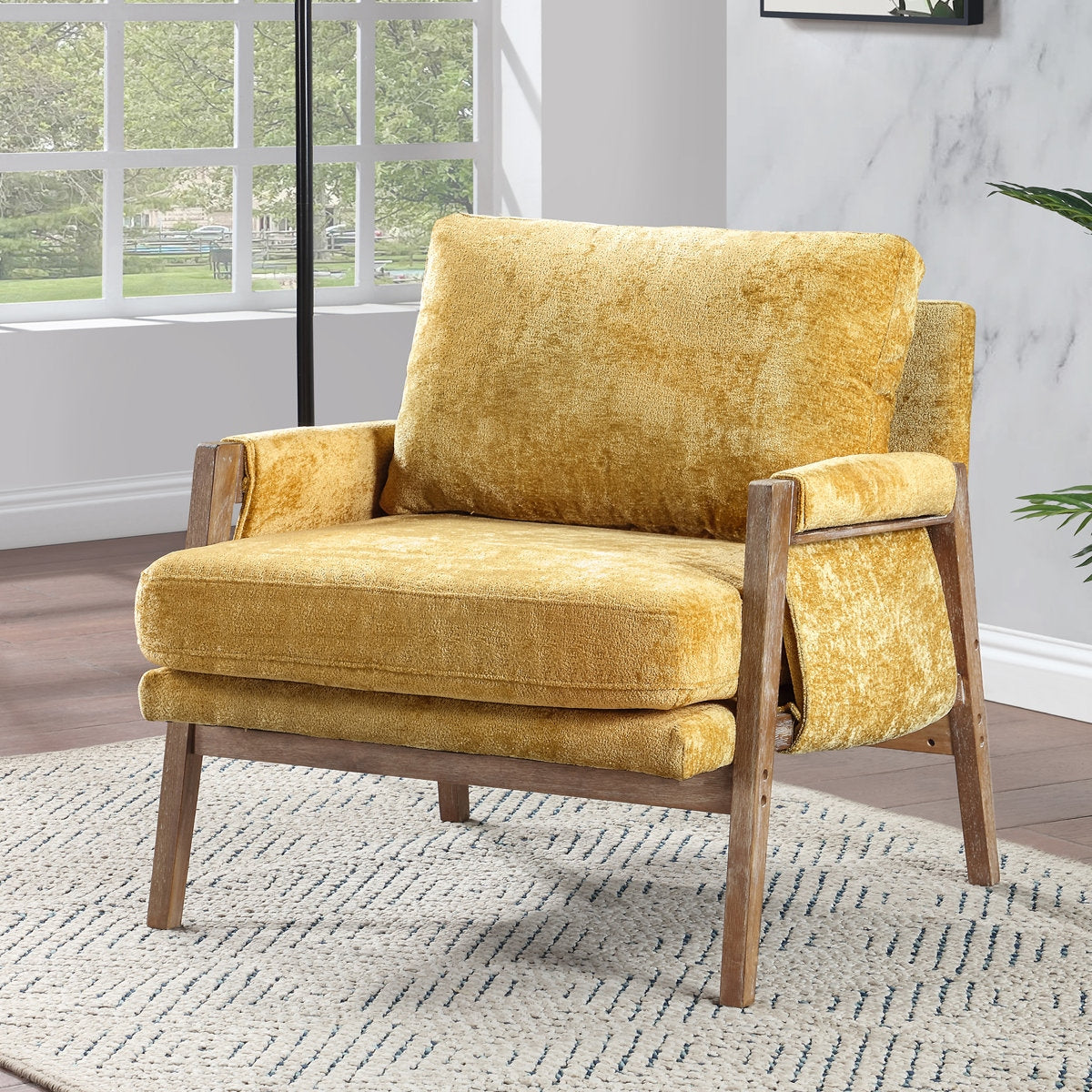 Yellow armchair in a room with a window and rug