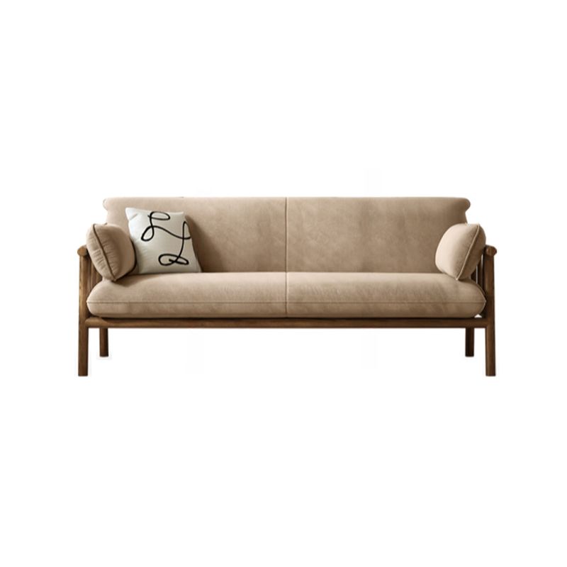 Beige sofa with wooden frame and cushions on a white background