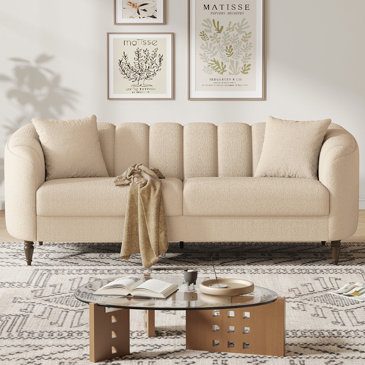 Beige sofa in a living room with a coffee table and decorative items.