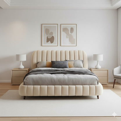 Beige upholstered bed in a modern bedroom with abstract art on the wall.