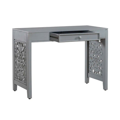 Gray desk with decorative front panel and drawer on a white background