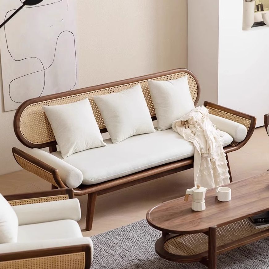 Modern living room with a wooden sofa and coffee table.