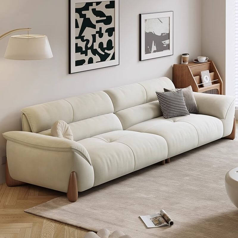 Beige sofa in a living room with abstract art on the wall