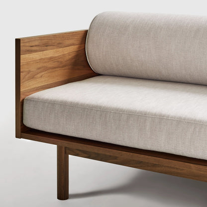 Sofa with wooden frame and beige cushions on a white background