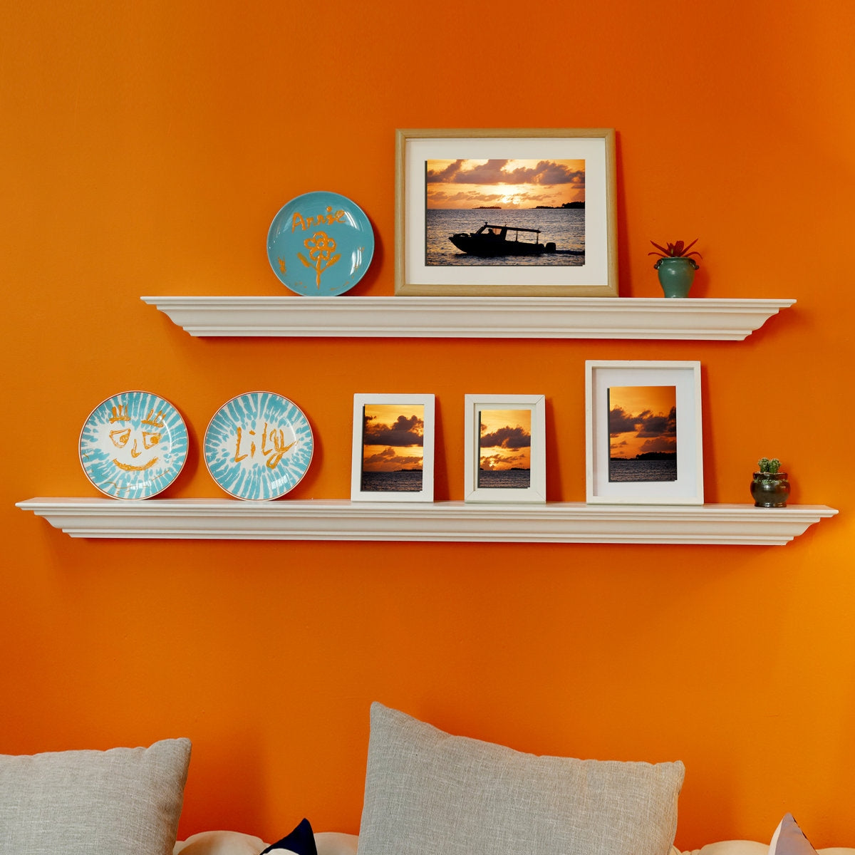 Shelving unit with decorative items against an orange wall