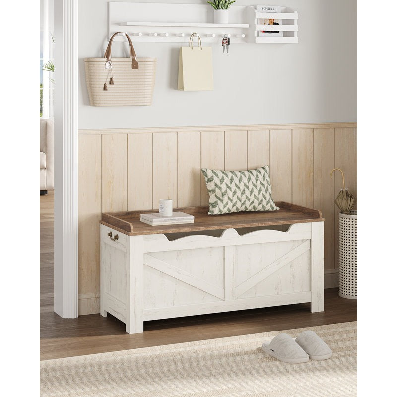 White storage bench with wooden top in a room setting with decor items.