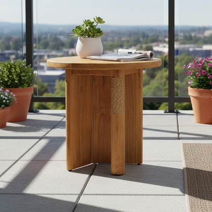 Wooden side table with a plant and magazine on a balcony with city view