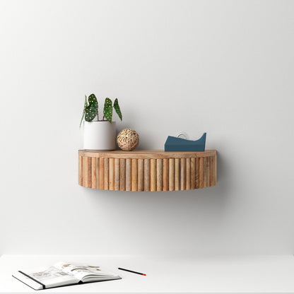 Wooden wall shelf with decorative items on a white background