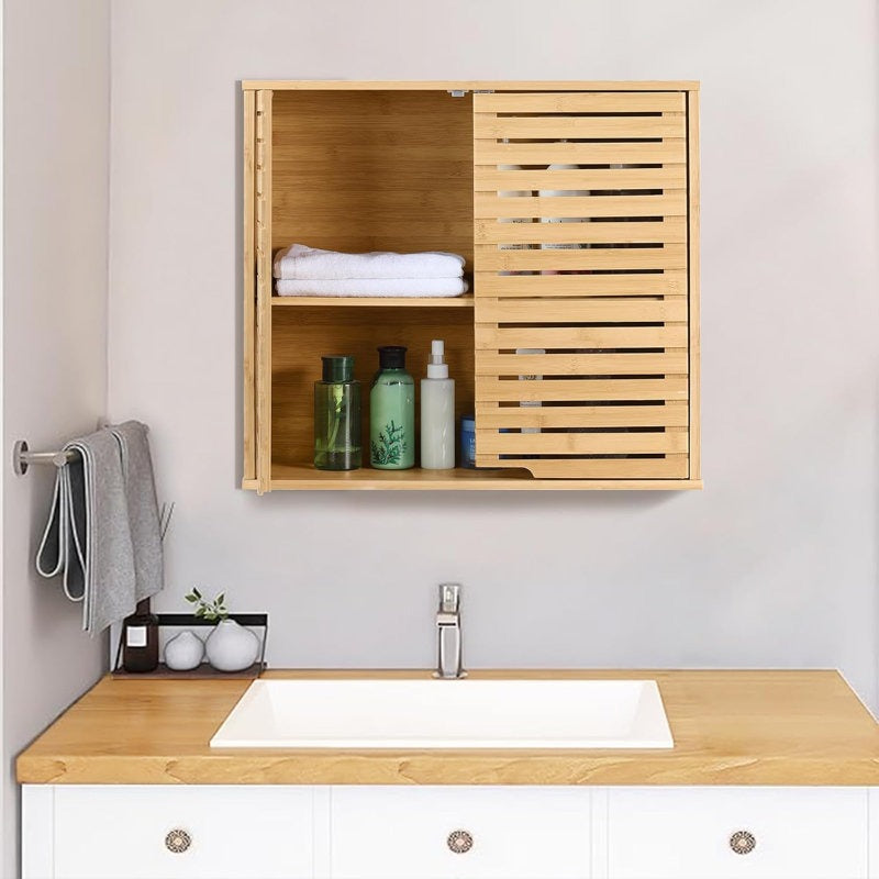 Bathroom with wooden cabinet, sink, and toiletries on a light gray wall.