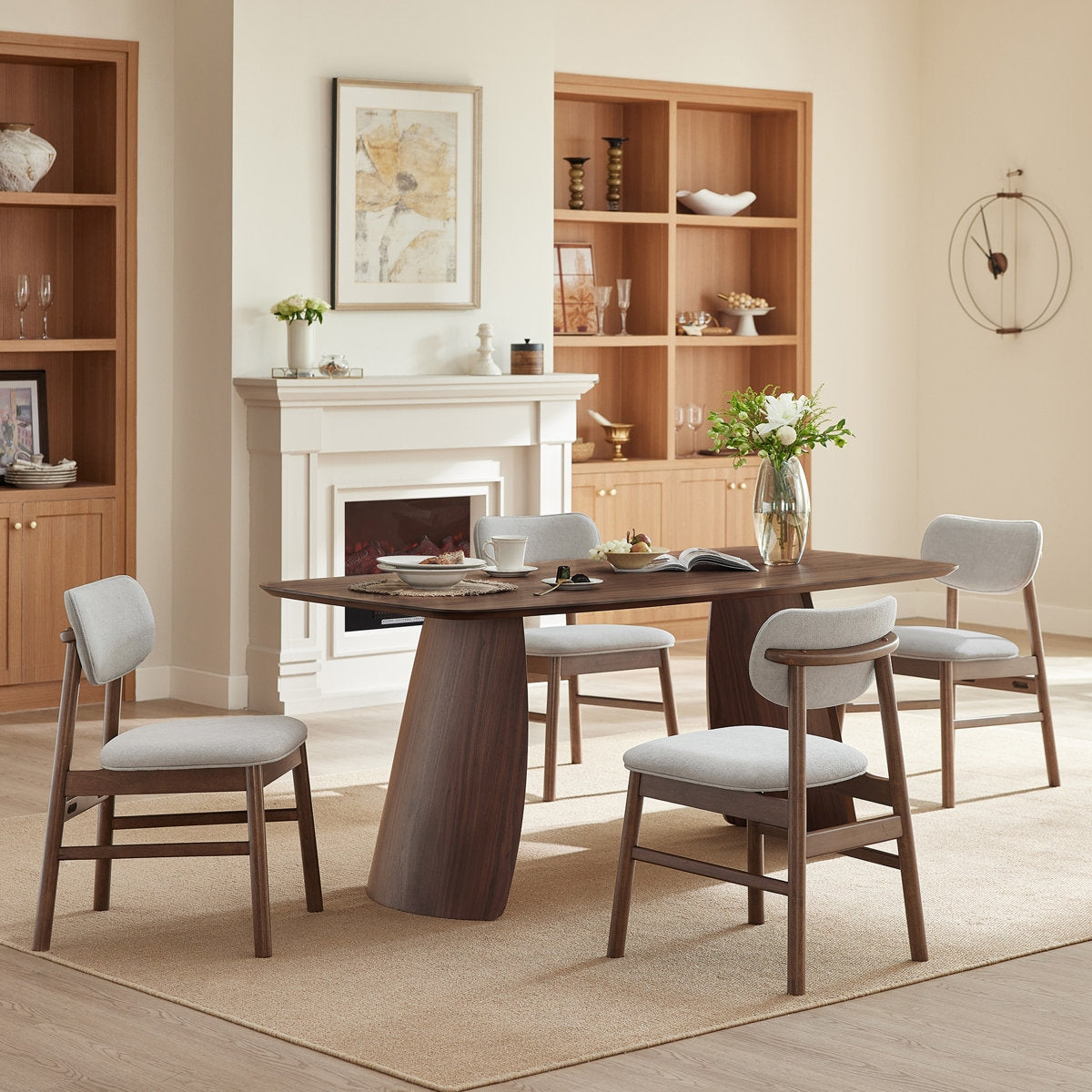 Dining room with wooden table and chairs in a well-lit room.