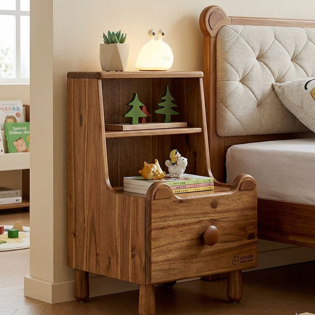 Wooden nightstand with decorative items next to a bed in a bedroom.