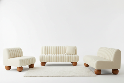 Set of three modern chairs in cream color with wooden legs on a white background