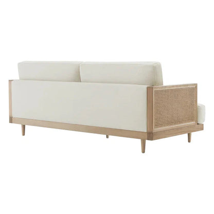 Sofa with white cushions and a wooden frame on a white background