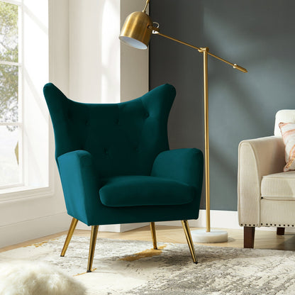 Teal armchair with gold legs in a living room setting