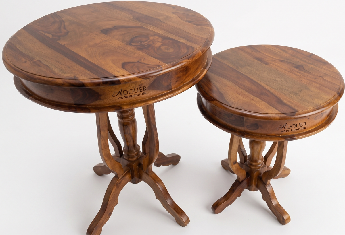 Two wooden round tables with ADOUER branding on a white background