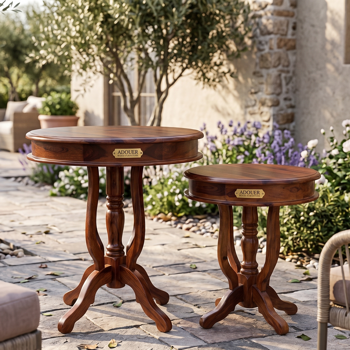 Two wooden side tables with 'ADOUER' branding on a patio with outdoor furniture and plants.