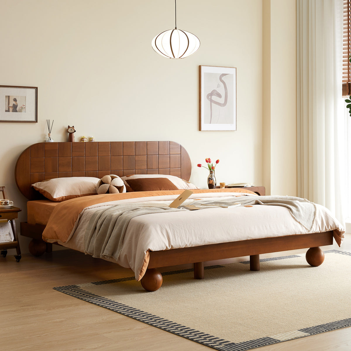 Wooden bed in a bedroom with a neutral color scheme