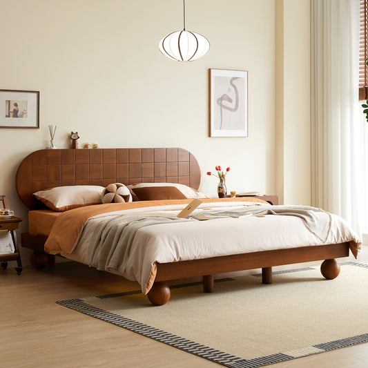 Wooden bed in a bedroom with a neutral color scheme