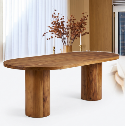 Wooden dining table with a vase of dried flowers on a white background