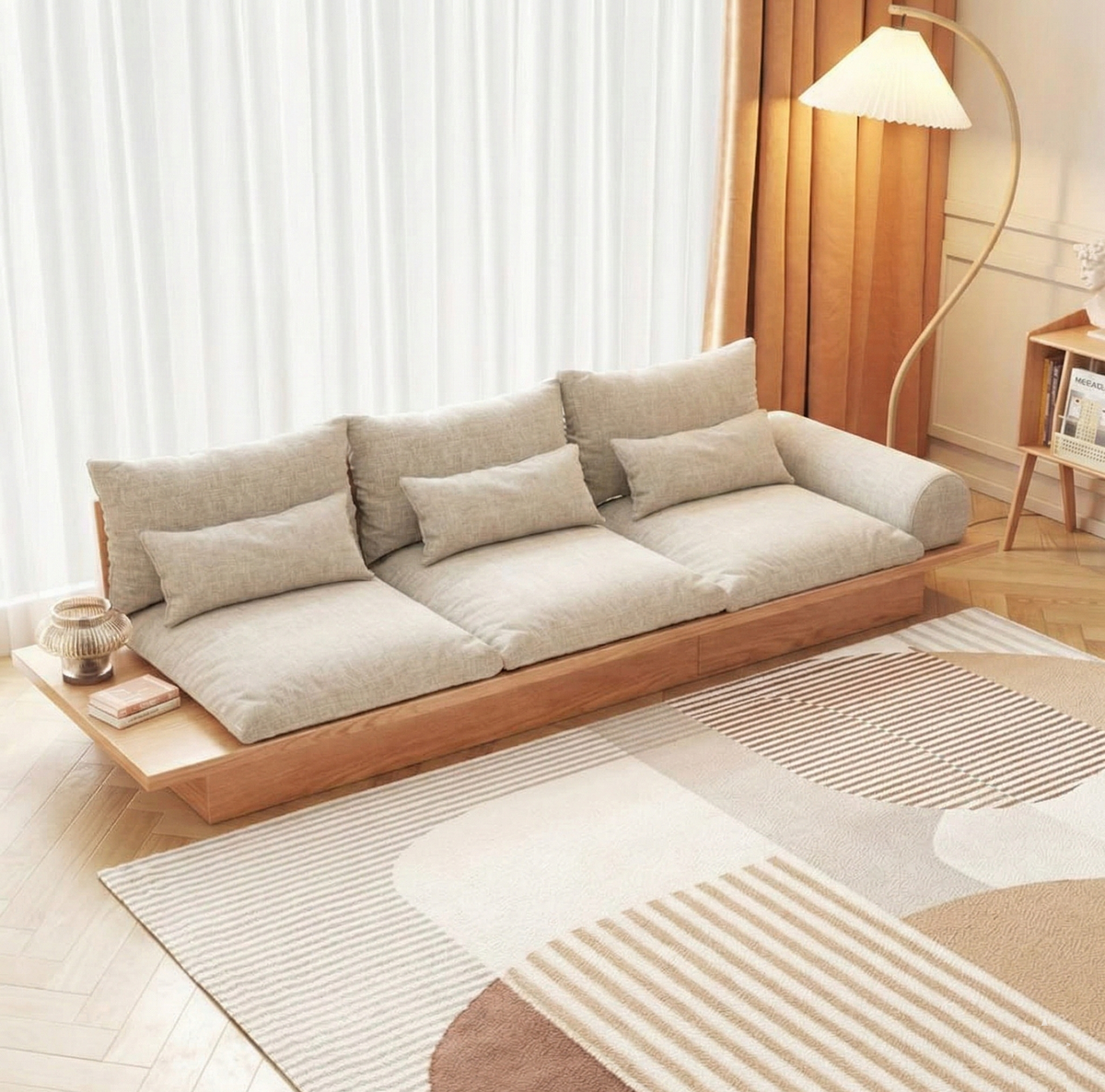 Modern living room with a beige sofa, wooden floor, and decorative rug.