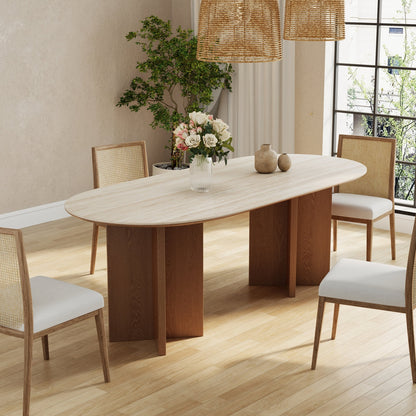 Dining room with a wooden table and chairs on a wooden floor.