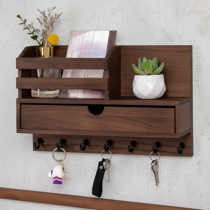 Wooden wall-mounted shelf with storage drawers and key hooks against a light gray wall.