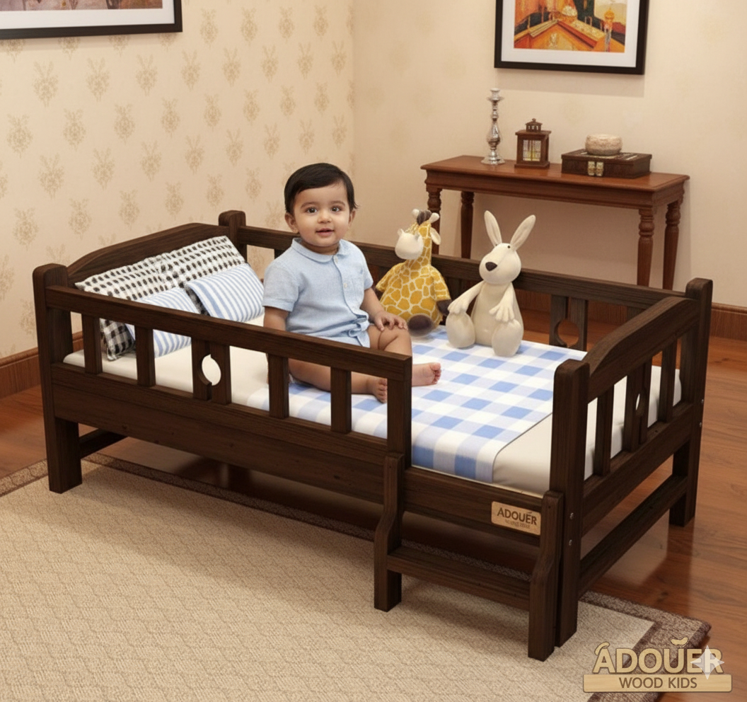 Child sitting on a wooden bed with stuffed animals in a room setting, featuring the ADOUER brand.