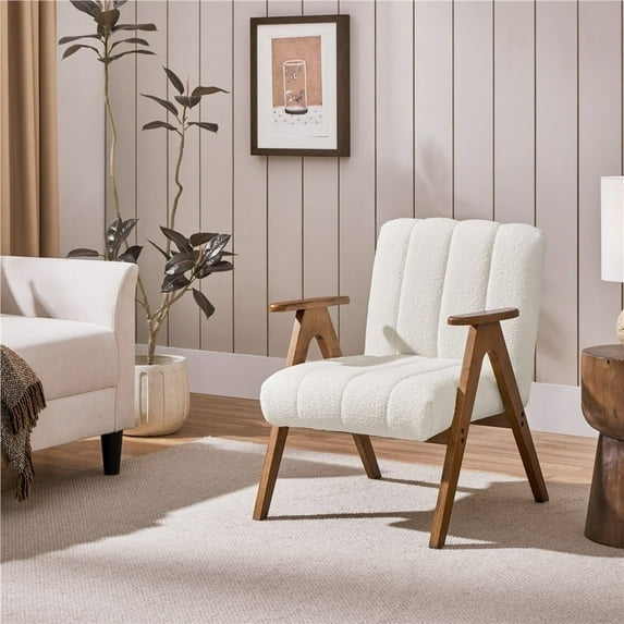 White armchair with wooden legs in a living room setting