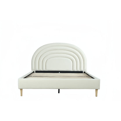 White bed with arch-shaped headboard on a white background