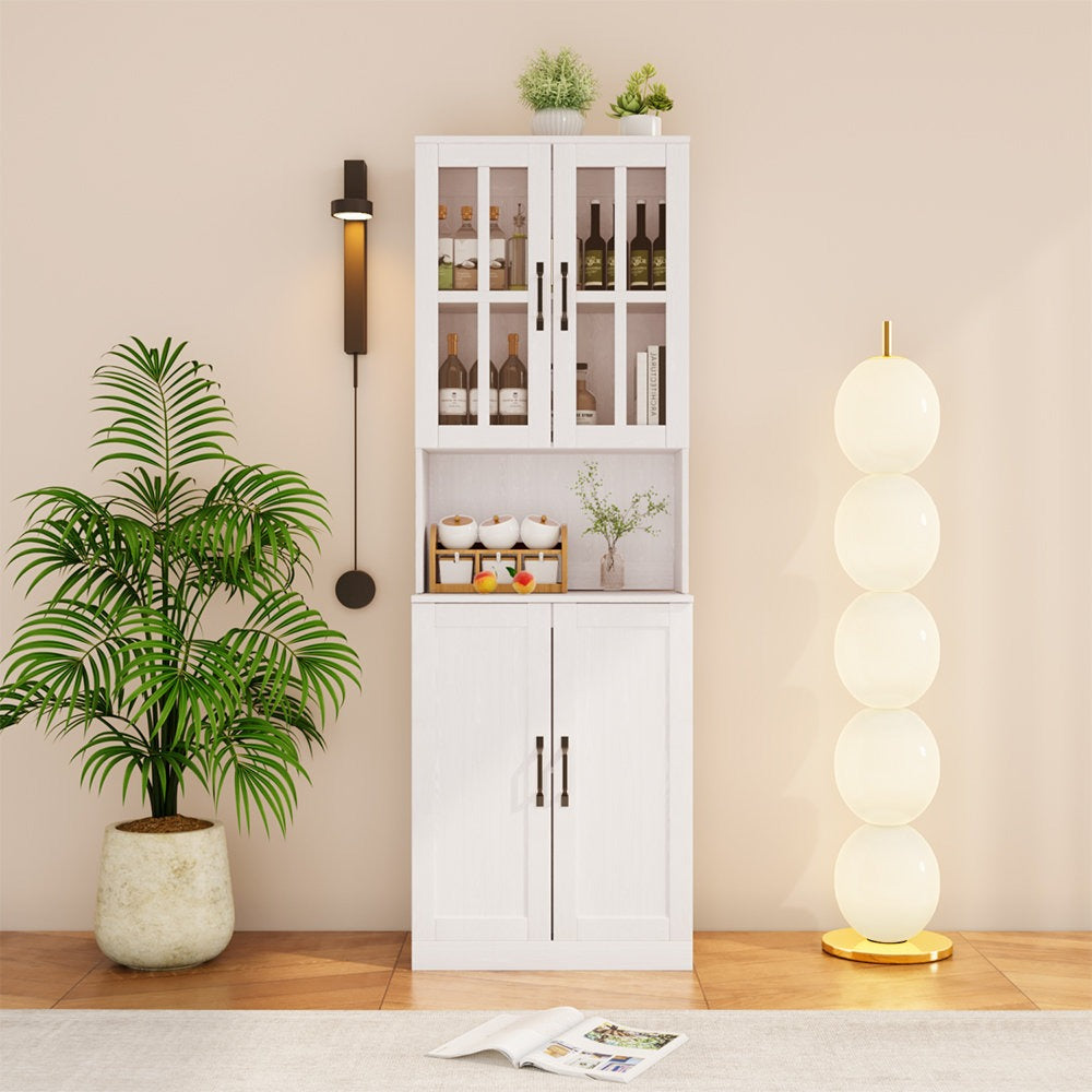 White cabinet with glass doors, potted plant, and standing lamp in a room.