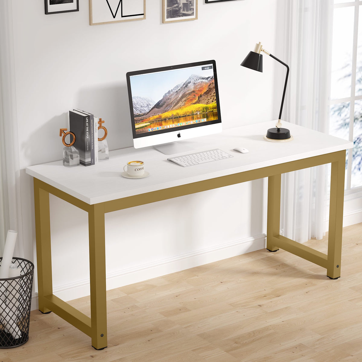 White desk with gold legs featuring a computer setup in a bright room.