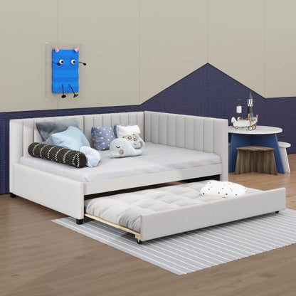 White sectional sofa with pull-out bed in a room with a blue wall and small table.