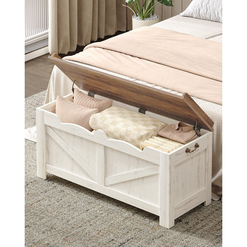 White storage bench with wooden lid in a bedroom setting