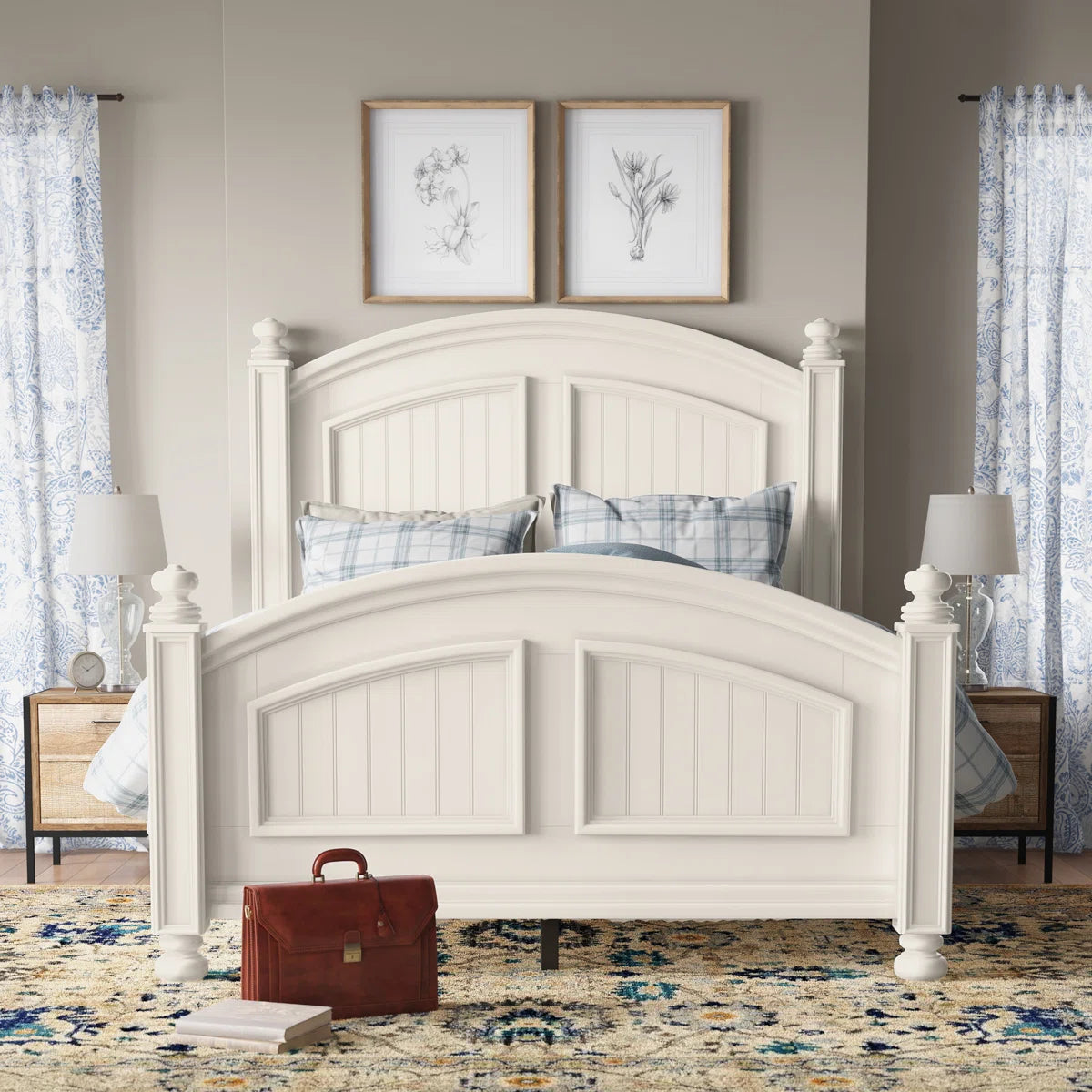 White wooden bed in a bedroom with nightstands, lamps, and decorative pillows.