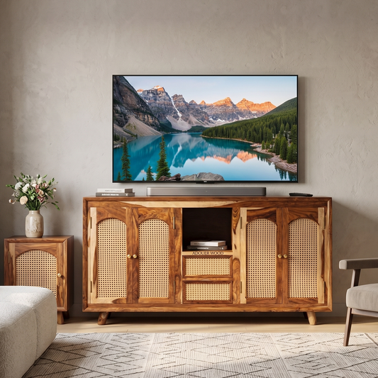 Wooden TV stand with a television displaying a mountain landscape in a living room.