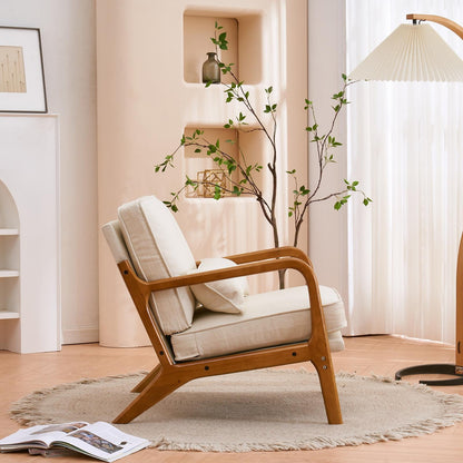 Wooden armchair with white cushions in a cozy living room setting.