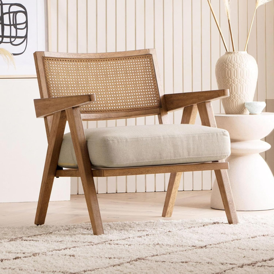 Wooden armchair with wicker backrest in a room with decorative elements.