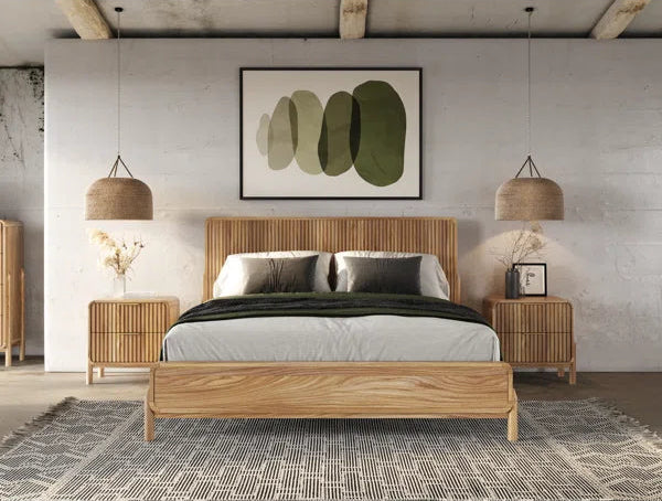 Wooden bed with matching nightstands and lamps in a modern bedroom setting.