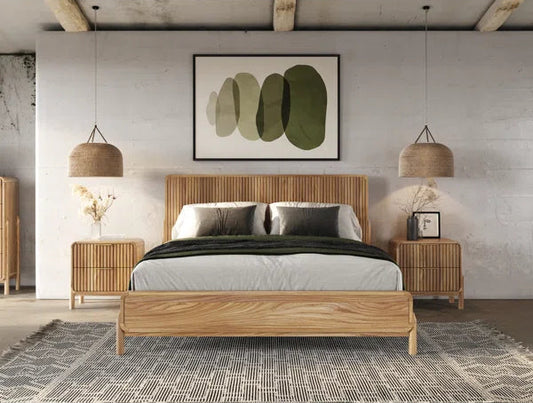 Wooden bed with matching nightstands and lamps in a modern bedroom setting.