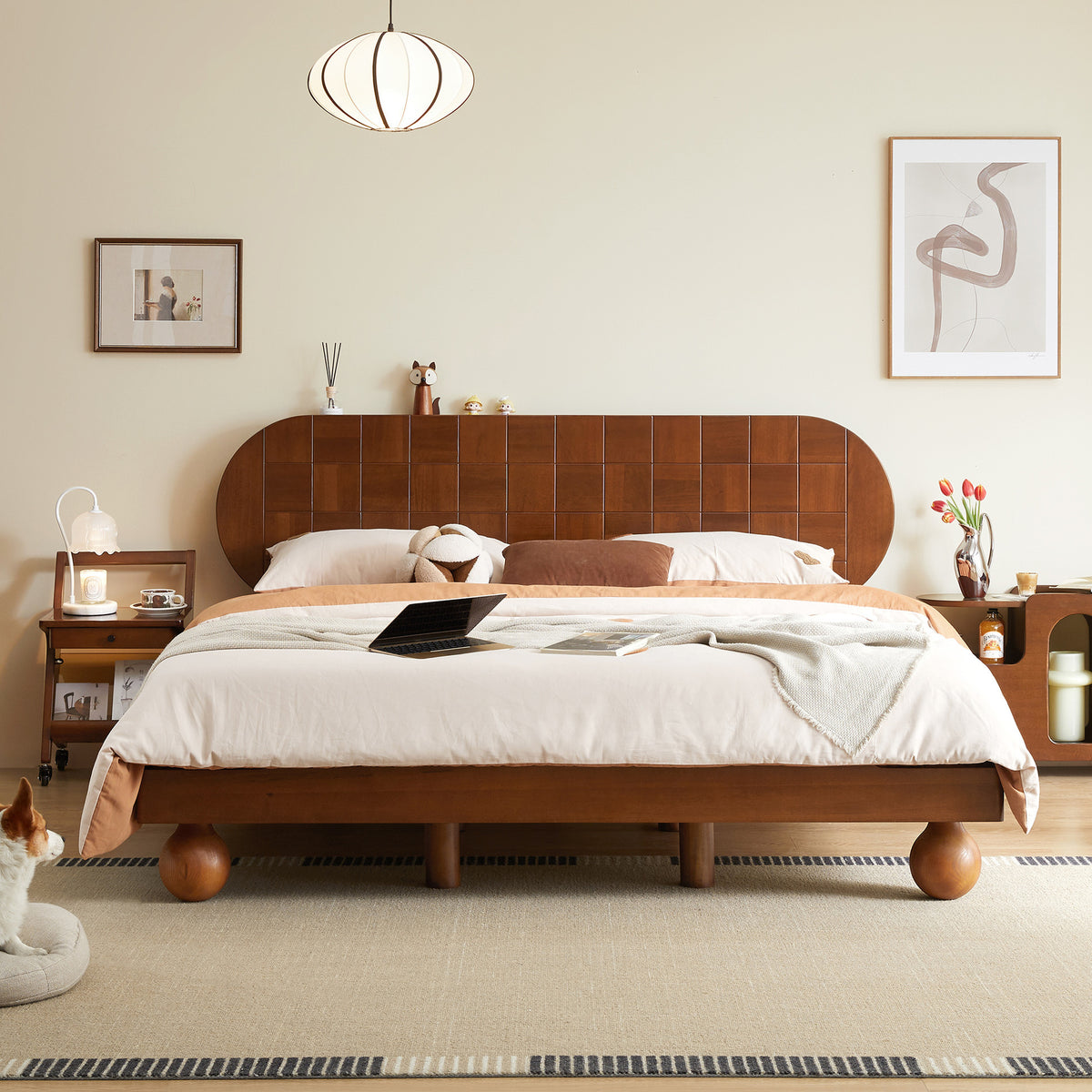 Wooden bed in a bedroom with a dog sitting on the floor.