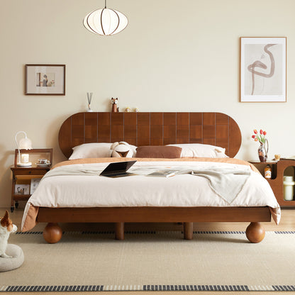 Wooden bed in a bedroom with a dog sitting on the floor.