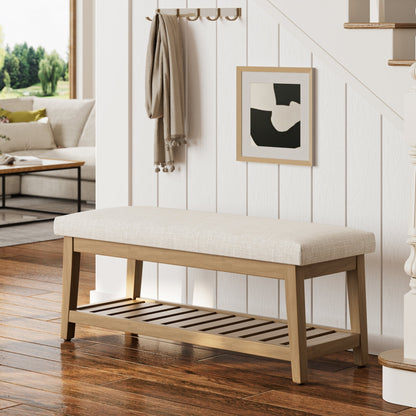 Wooden bench with a cushioned seat in a living room setting.