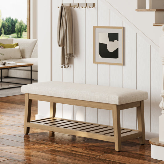 Wooden bench with a cushioned seat in a living room setting.