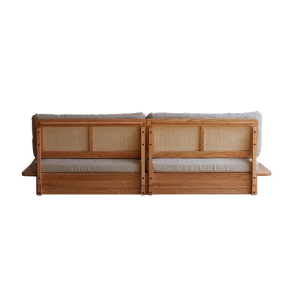 Wooden bench with woven backrests and cushioned seat on a white background