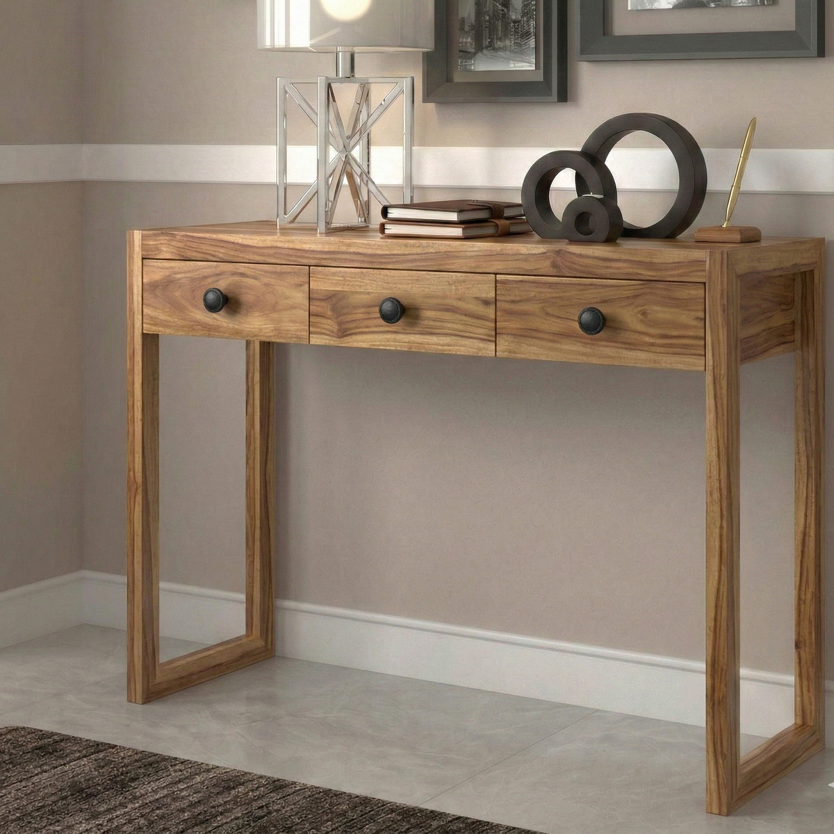 Wooden console table with decorative items against a neutral wall.