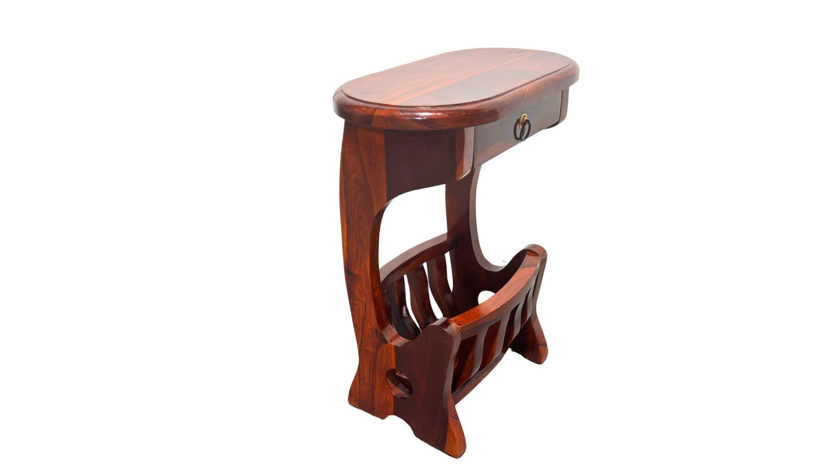 Wooden console table with a curved top and magazine rack on a white background