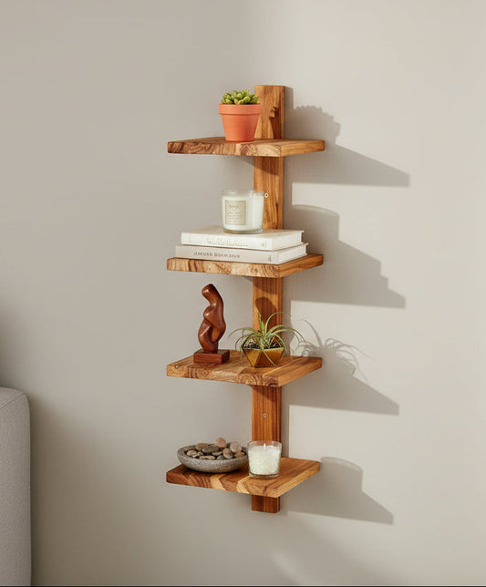 Wooden corner shelf with decorative items against a plain wall