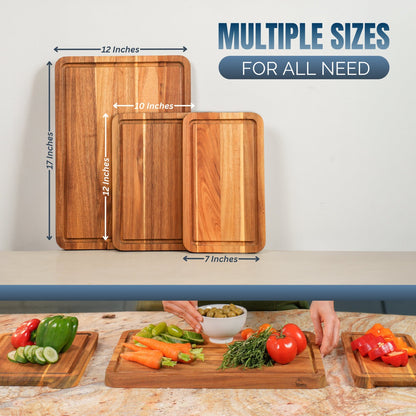 Wooden cutting boards of different sizes with measurements and a person preparing vegetables on a countertop.