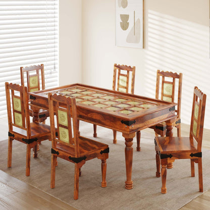 Wooden dining table with six matching chairs in a room with white blinds.