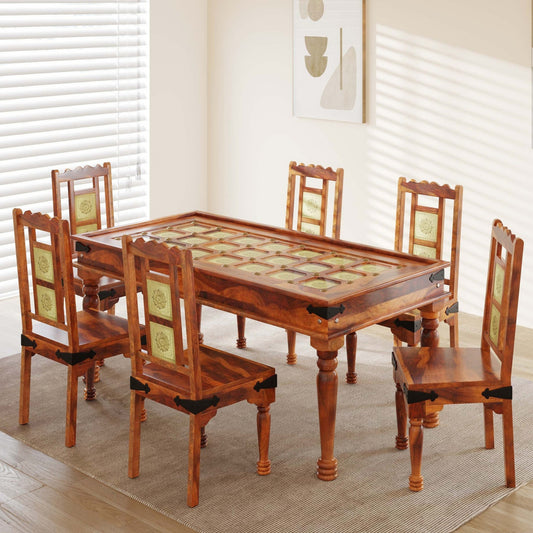 Wooden dining table with six matching chairs in a room with white blinds.